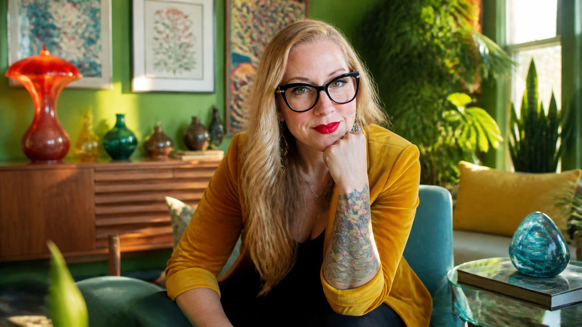 Sherry Martin in a genuinely photorealistic luminary-style scene in her vibrant mid-century-modern home, pensive in warm dayl