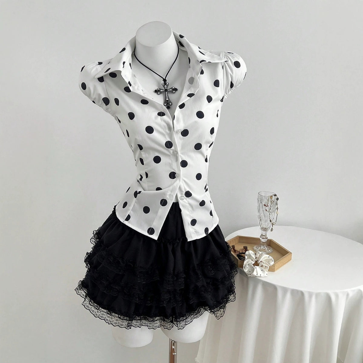 Polka dot printed lace up waist cinching short sleeved women's shirt