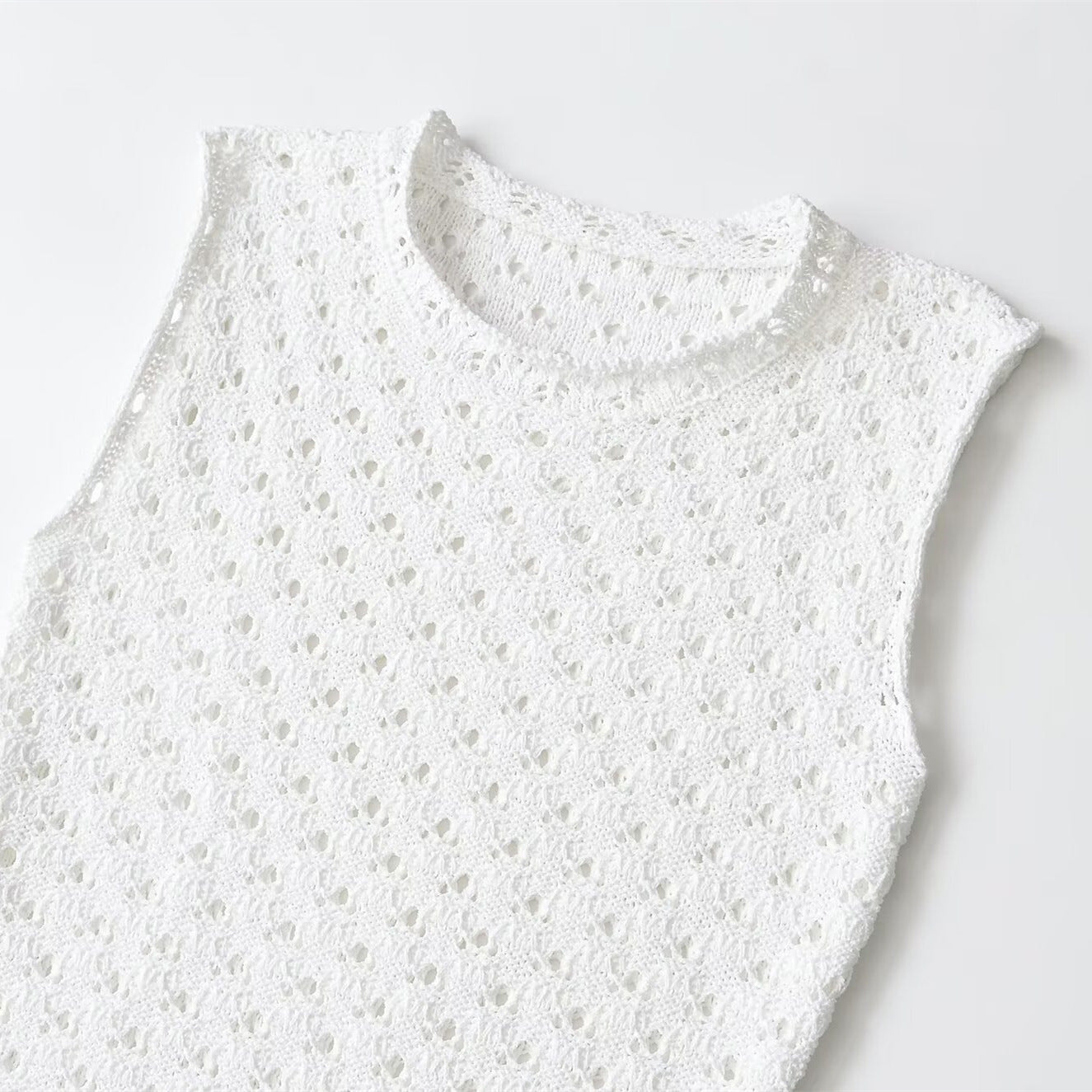 Sleeveless round neck hollow knitted mini dress