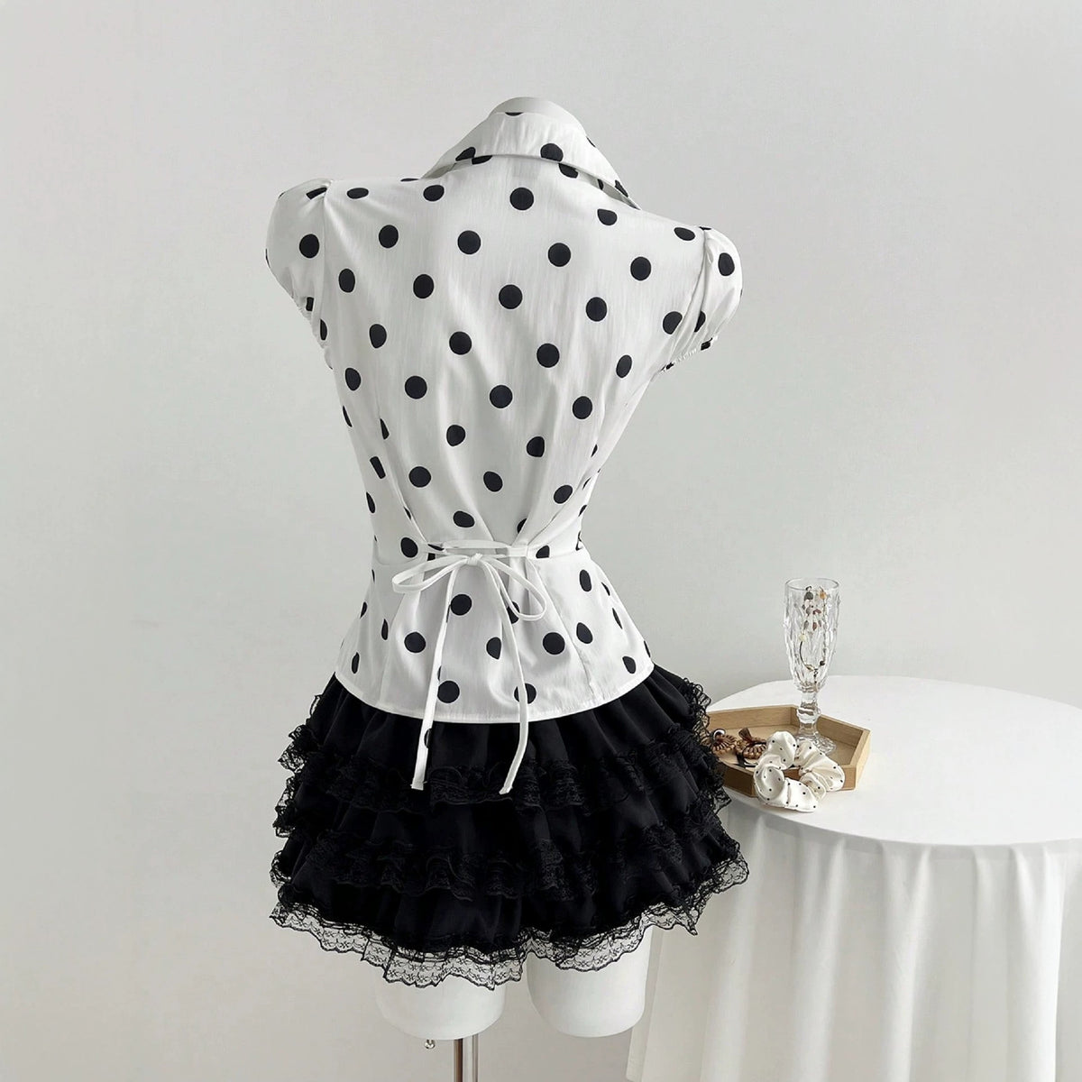 Polka dot printed lace up waist cinching short sleeved women's shirt