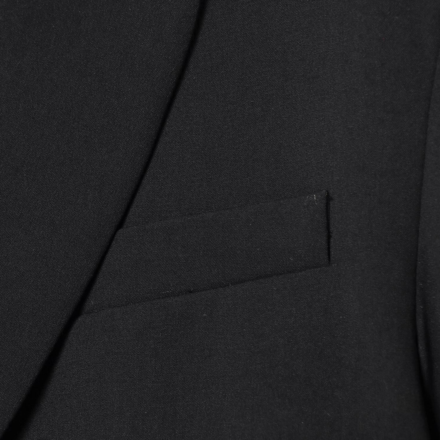 Black short suit jacket with shoulder pads and pleats